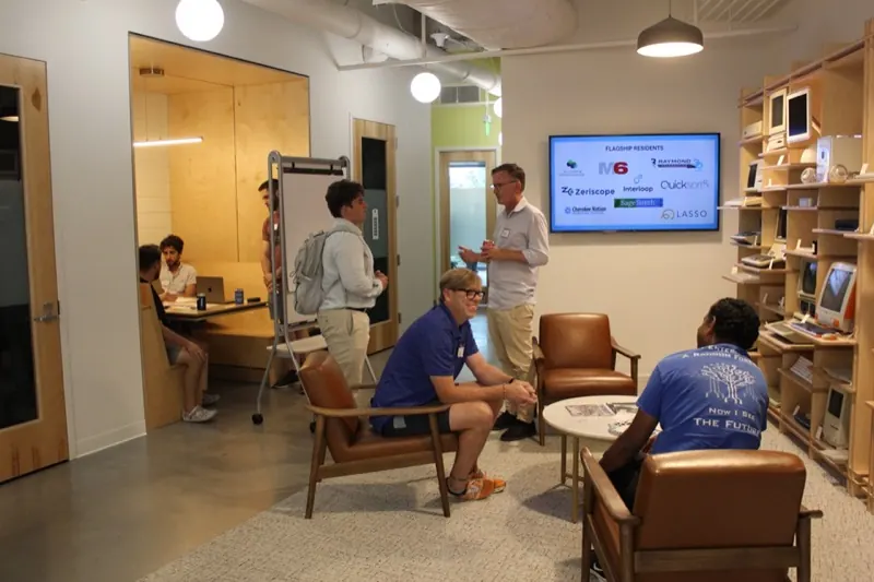 Presenter explaining a project at CharlestonHacks
